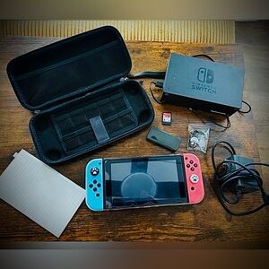 Nintendo Switch with Blue & Red Controllers and Accessories